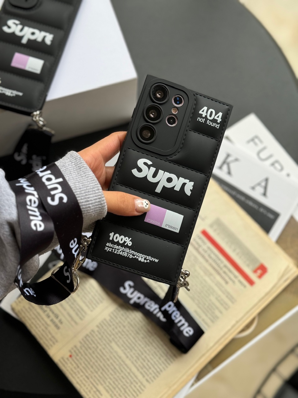 قاب پافر Supreme با بند آیفون ، سامسونگ ، شیائومی